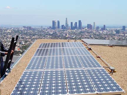 An array of photo-voltaic cells on a roof